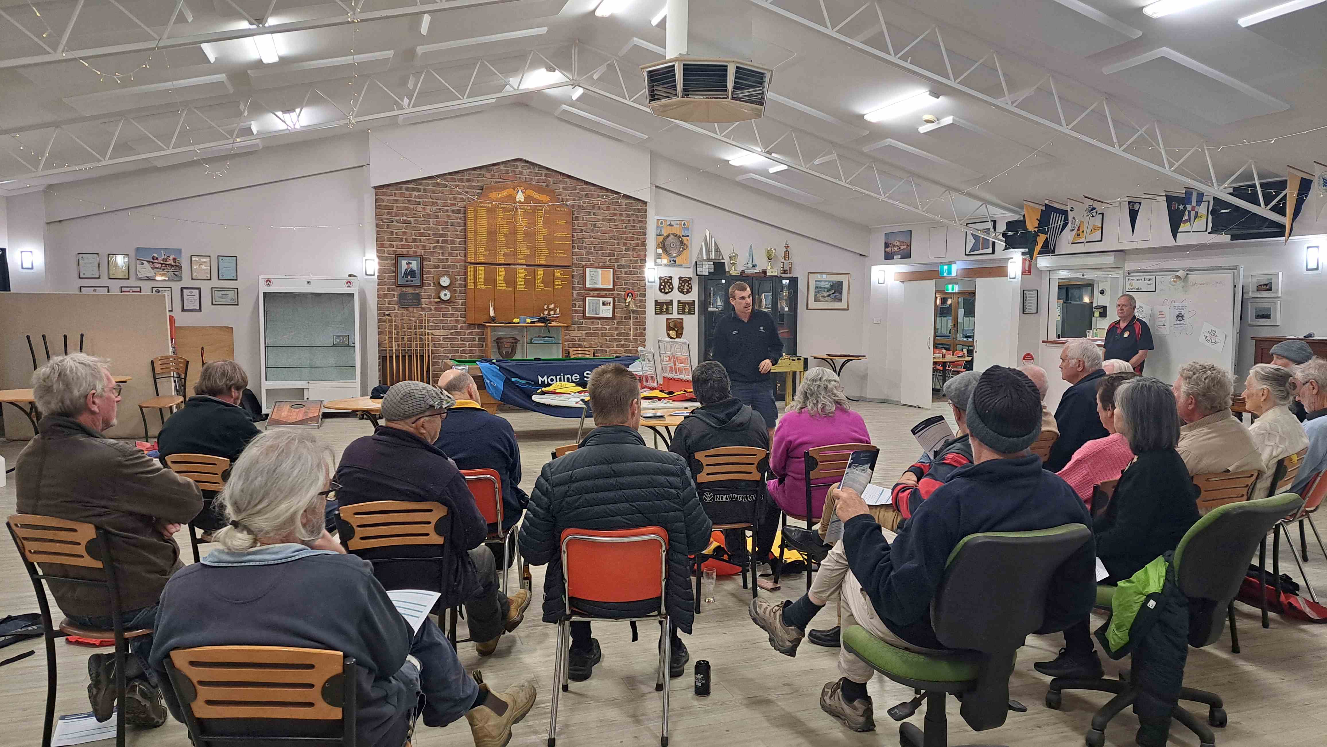 Pictured is one of our Marine Safety Officers conducting a stay afloat clinic to roughly 25 members of the Garden Island Boat Club. This clinic is held at their boat club and we are available to educate and show how to maintain lifejackets.