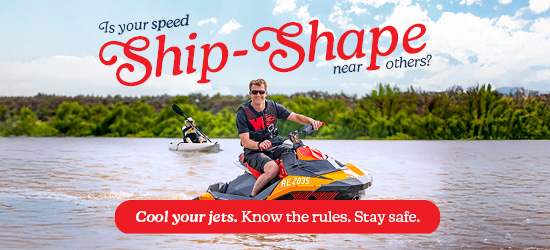 Pictured is a man on a orange jetski smiling in the sunshine on the river murray. Behind him in the image is a kayaker enjoying the sunshine also.