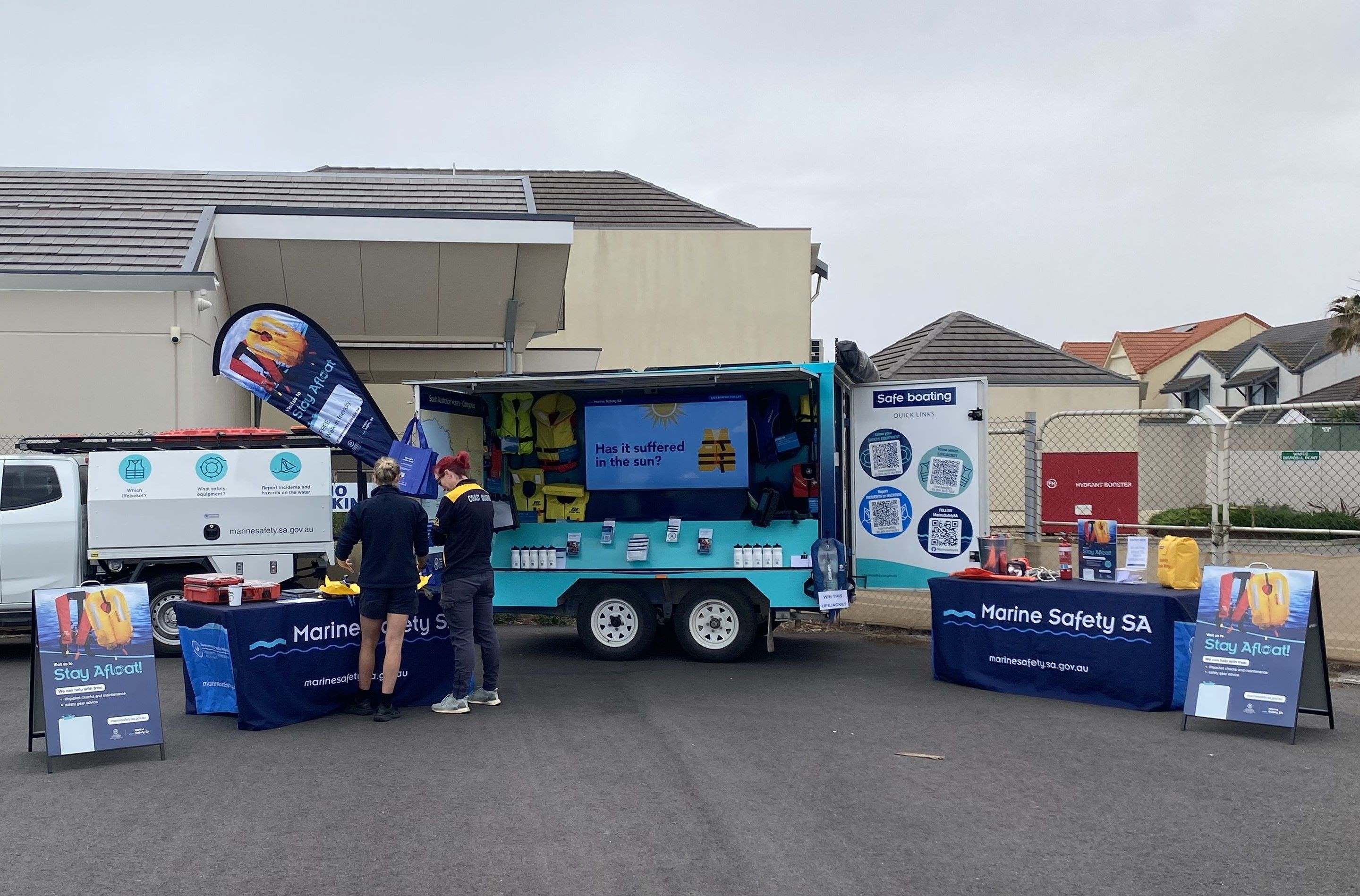 Our Marine Safety SA Stay Afloat Trailer setup with lifejackets and tables to conduct lifejacket maintenance checks for the public