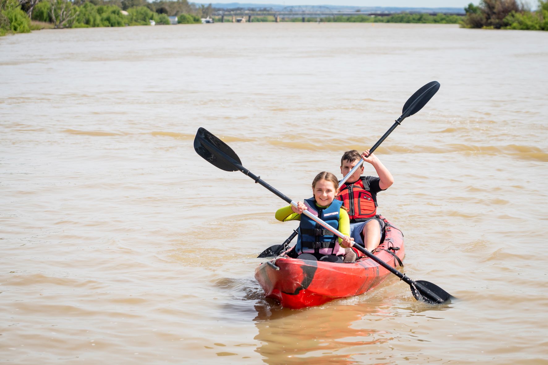 Boy and girls in a kayak on the river